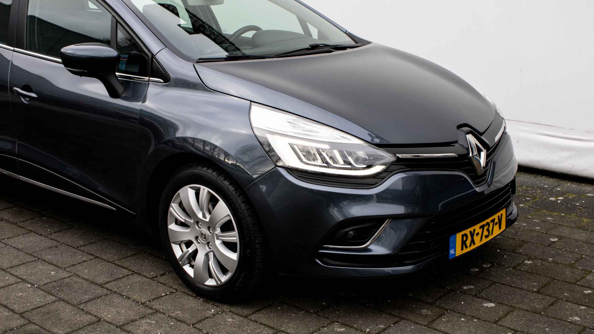 Renault Clio Estate 1.5 dCi Ecoleader Intens Navigatie/ Pdc/ Tel. bluetooth/ Cruise control/ Half leer/ Lmv - 27/29