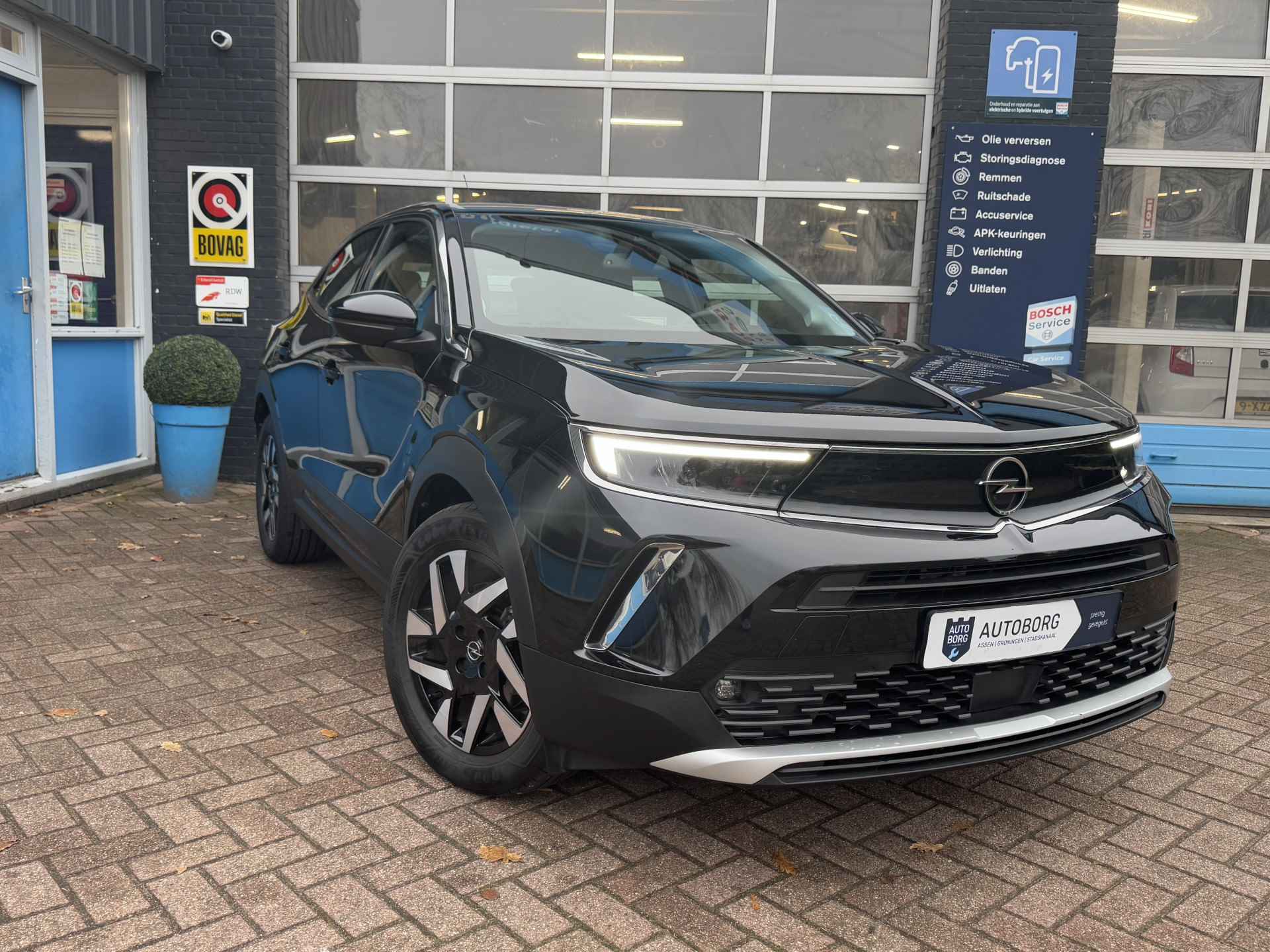 Opel Mokka-e Elegance 50-kWh 11kw bl. | Voorstoelen Verwarmd | Achteruitrijcamera | Stuurverwarming | Rijklaar + 12 Maand BOVAG Garantie - 49/56