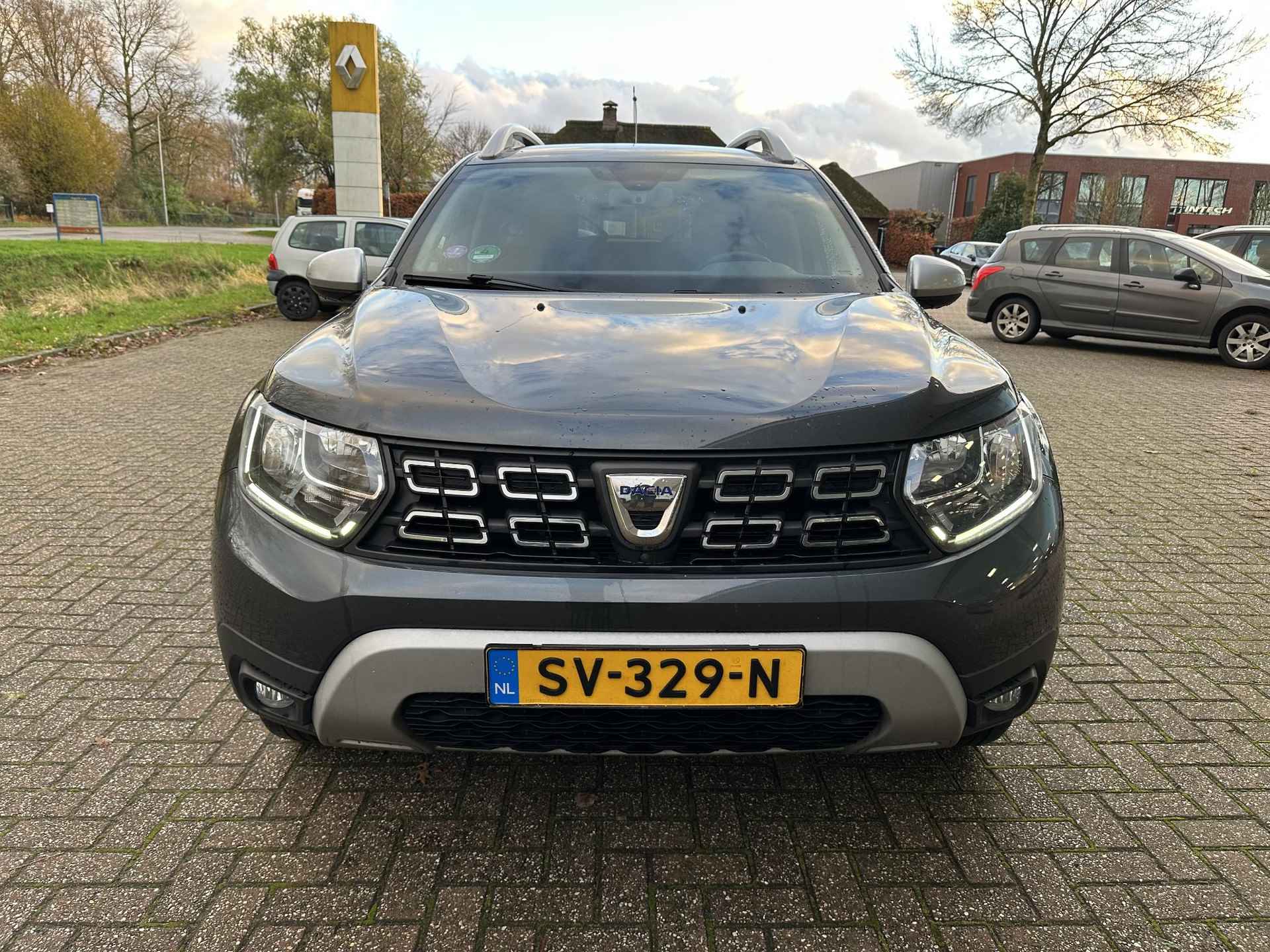 Dacia Duster 1.2 TCe 125 4x4 Prestige | Trekhaak | Navi | Clima | Leder | Cruise | Keyless | 360° camera | NL-auto + dealer onderhouden! - 4/27