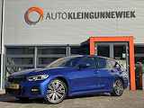 BMW 3 Serie Touring /320e Business Edition Plus M Sport Pakket / Portimao Blau / Stoel & Stuurverwarming / Wegklapbare Trekhaak /