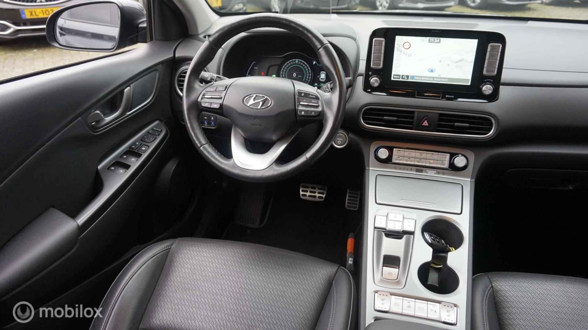 Hyundai Kona EV Premium 64 kWh Afn.Trekhaak | Leder | Elektr. Stoelverst. | Navi | Adapt. Cruise Control - 31/38