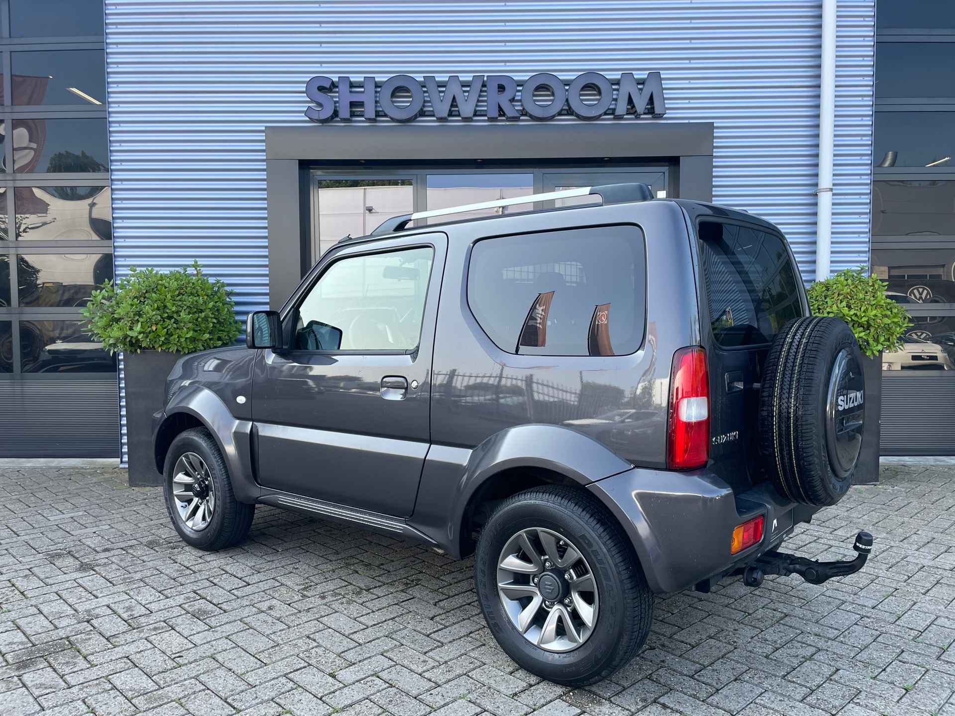 Suzuki JIMNY 1.3 Exclusive Leer|Afneembare trekhaak|Airco|Carbox met scheidingsrek - 4/26