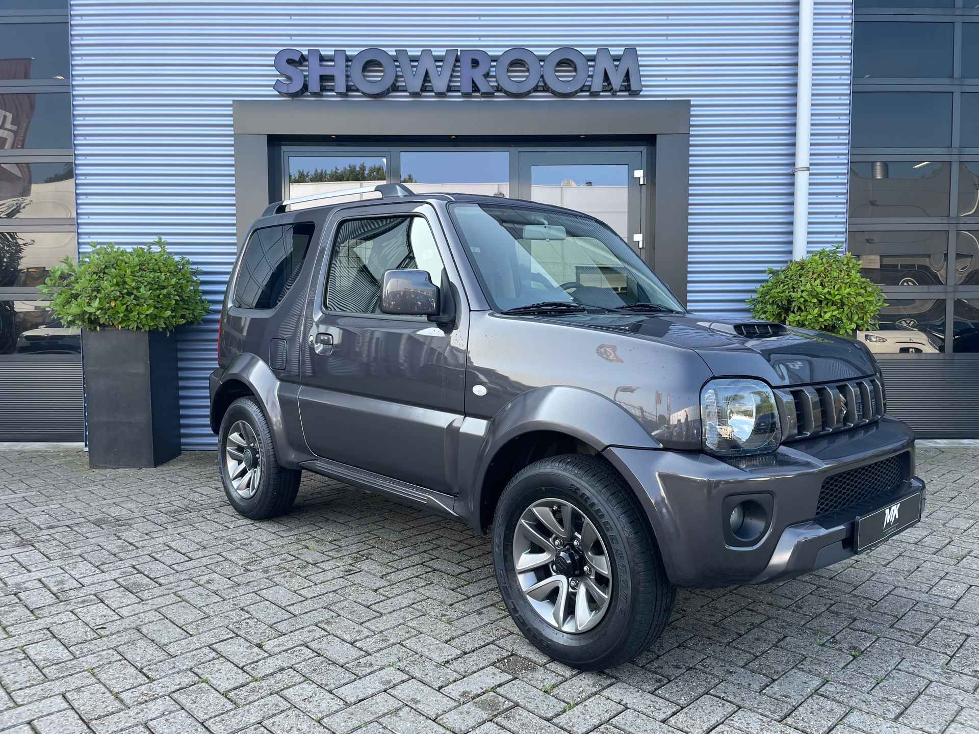 Suzuki JIMNY 1.3 Exclusive Leer|Afneembare trekhaak|Airco|Carbox met scheidingsrek - 10/26