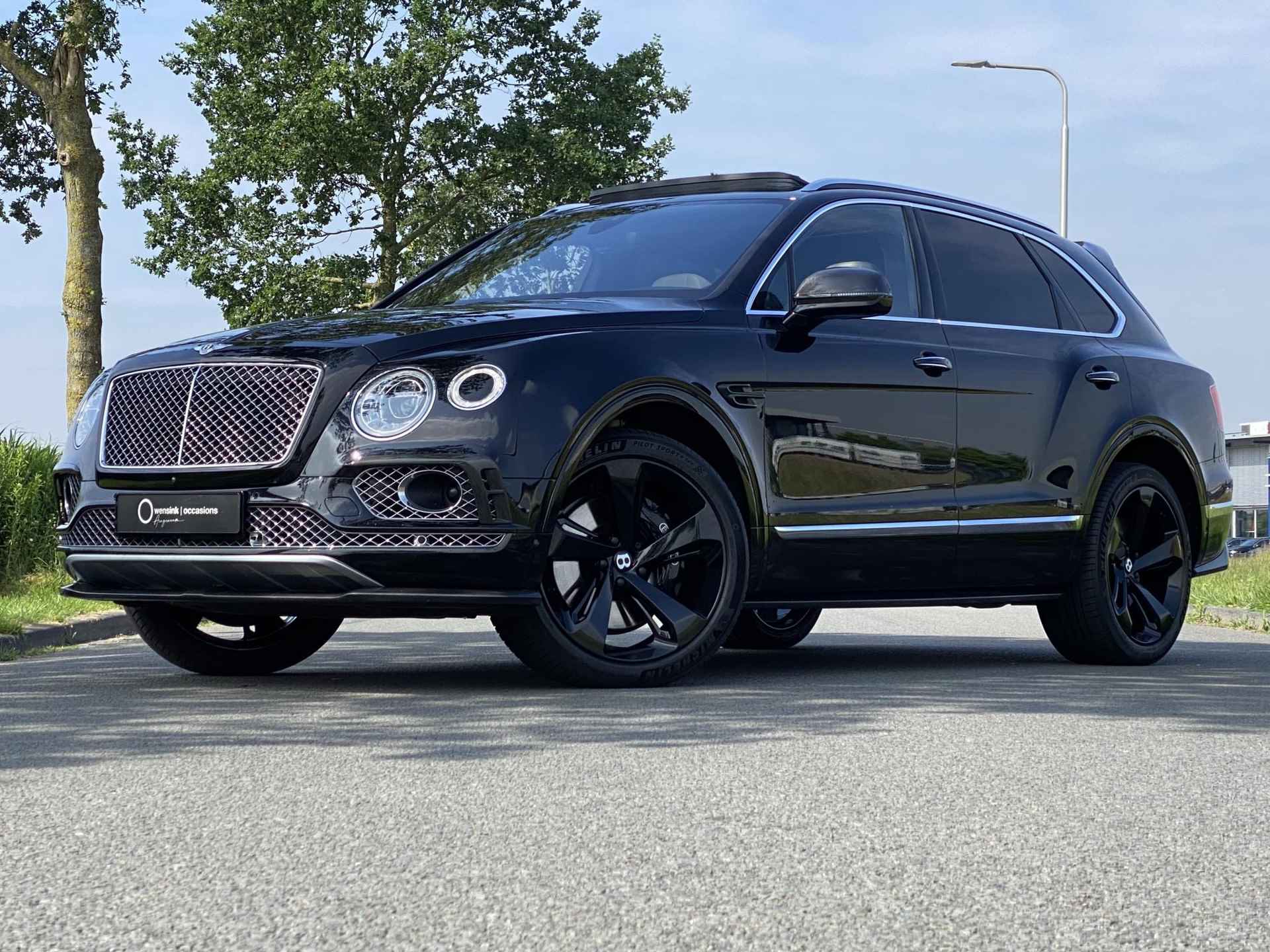 Bentley Bentayga 6.0 W12 | Nachtzicht | Adaptieve CruiseControl | 360 Camera | Panoramadak | 22” Lichtmetaal | Stuurwiel verwarmd | Elektrische zetels + Geheugen | NAIM Sound | Elektrische Trekhaak | Niveau Regeling | Carbon Pakket | NL Auto | - 3/97