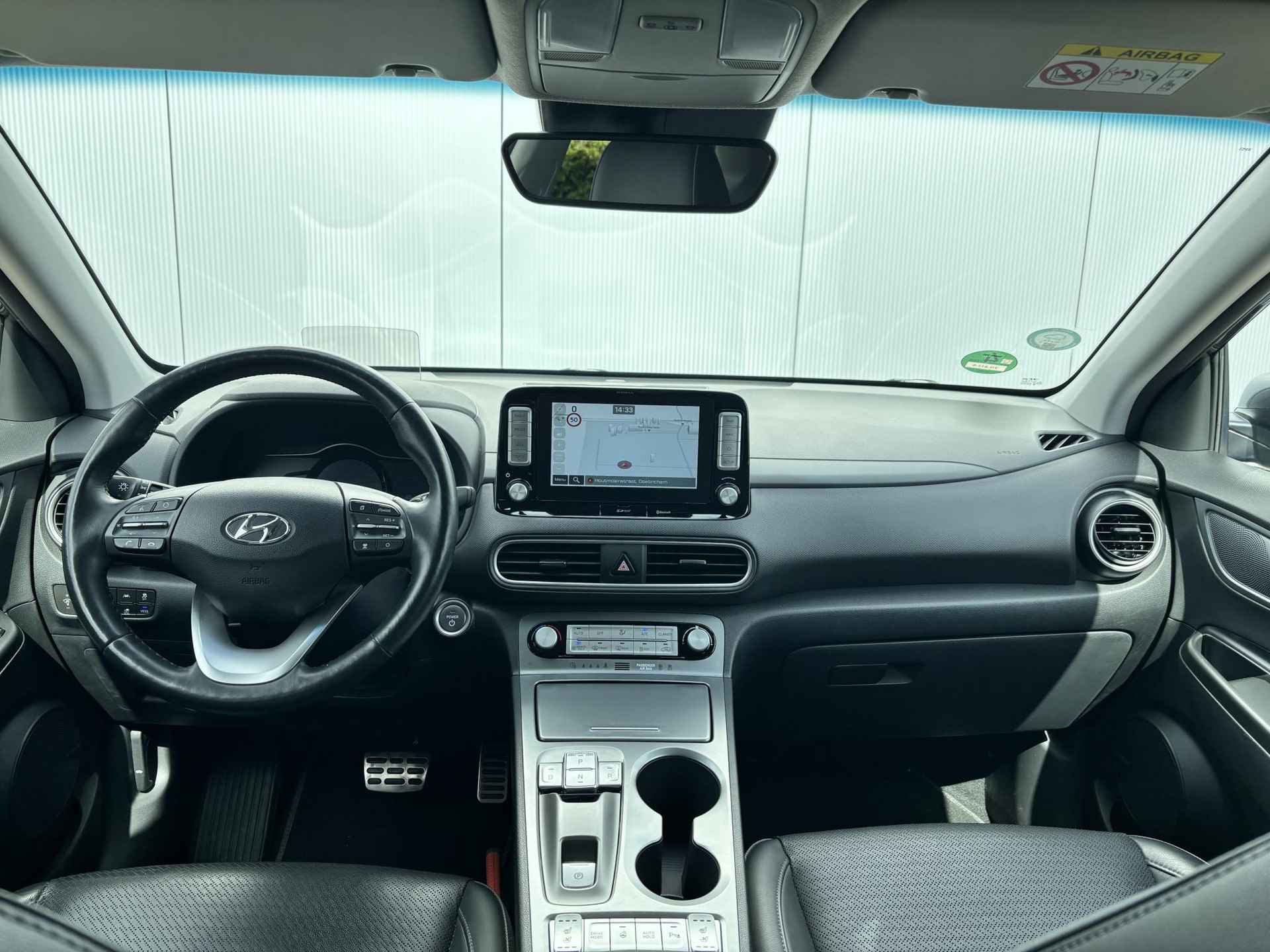 Hyundai Kona EV Premium 64 kWh / Electronic Climate Control / Apple Carplay & Android Auto / Navigatie / Lederen Bekleding / Automaat - 5/33
