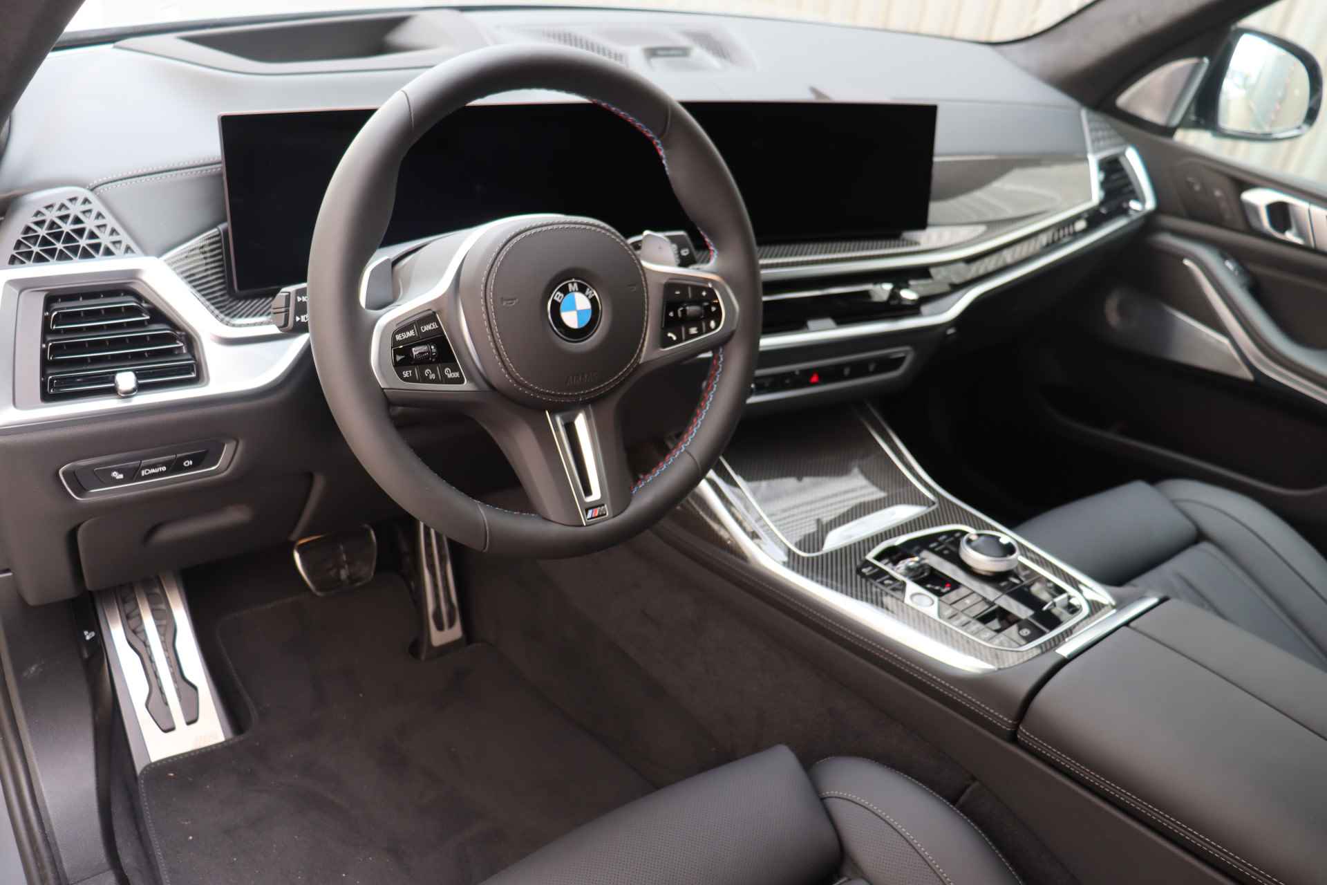 BMW X7 M60i xDrive High Executive Automaat / Panoramadak Sky Lounge / Trekhaak / Massagefunctie / Bowers & Wilkins / Parking Assistant Professional / Active Steering / Soft-Close - 11/27