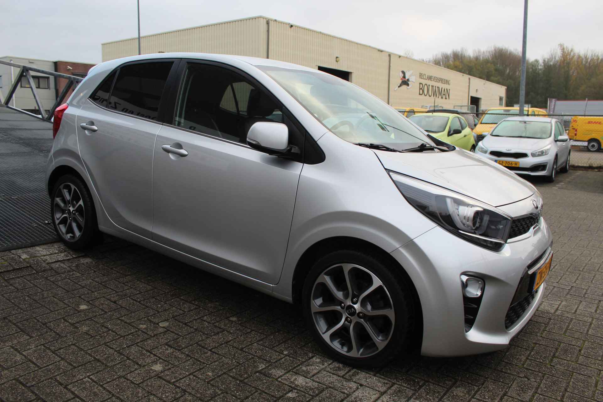 Kia Picanto 1.0 CVVT Design Edition Camera/Licht metaal/Navigatie/Cruise en climate control/Spiegels inklap en verwarmbaar/Half leder - 7/21