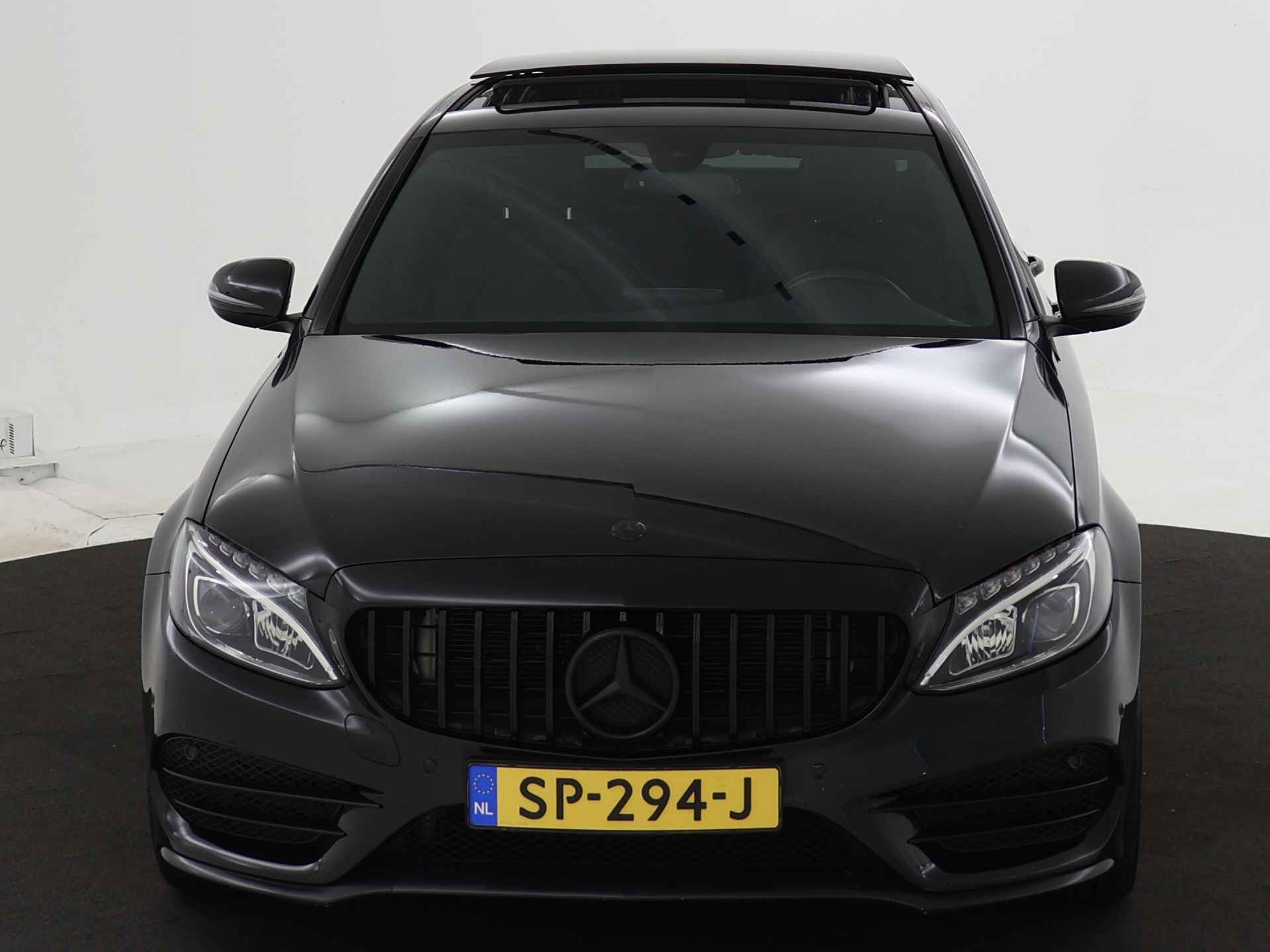 Mercedes-Benz C-Klasse 180 Premium AMG | Panoramadak | AMG Styling | Panamera Grille | Achteruitrijcamera | Leder | Inclusief 24 maanden Mercedes-Benz Certified garantie voor Europa. - 24/40