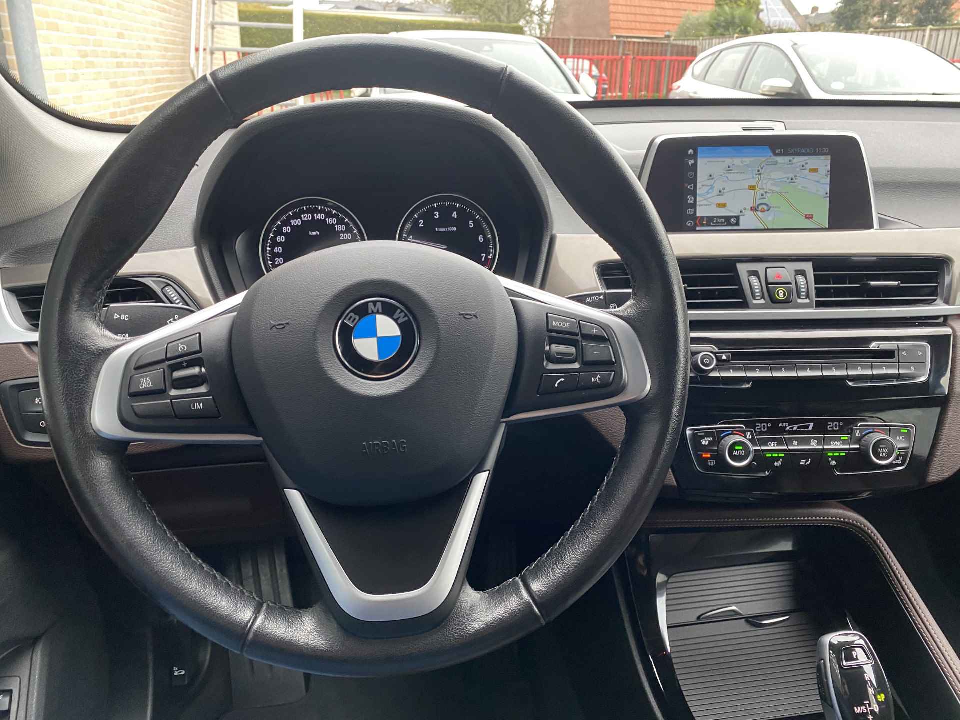 BMW X1 sDrive18i 140 pk Executive Edition AUT. | 1e eigenaar | navigatie | bruin leder interieur | trekhaak | lichtmetalen velgen 18'' - 27/46