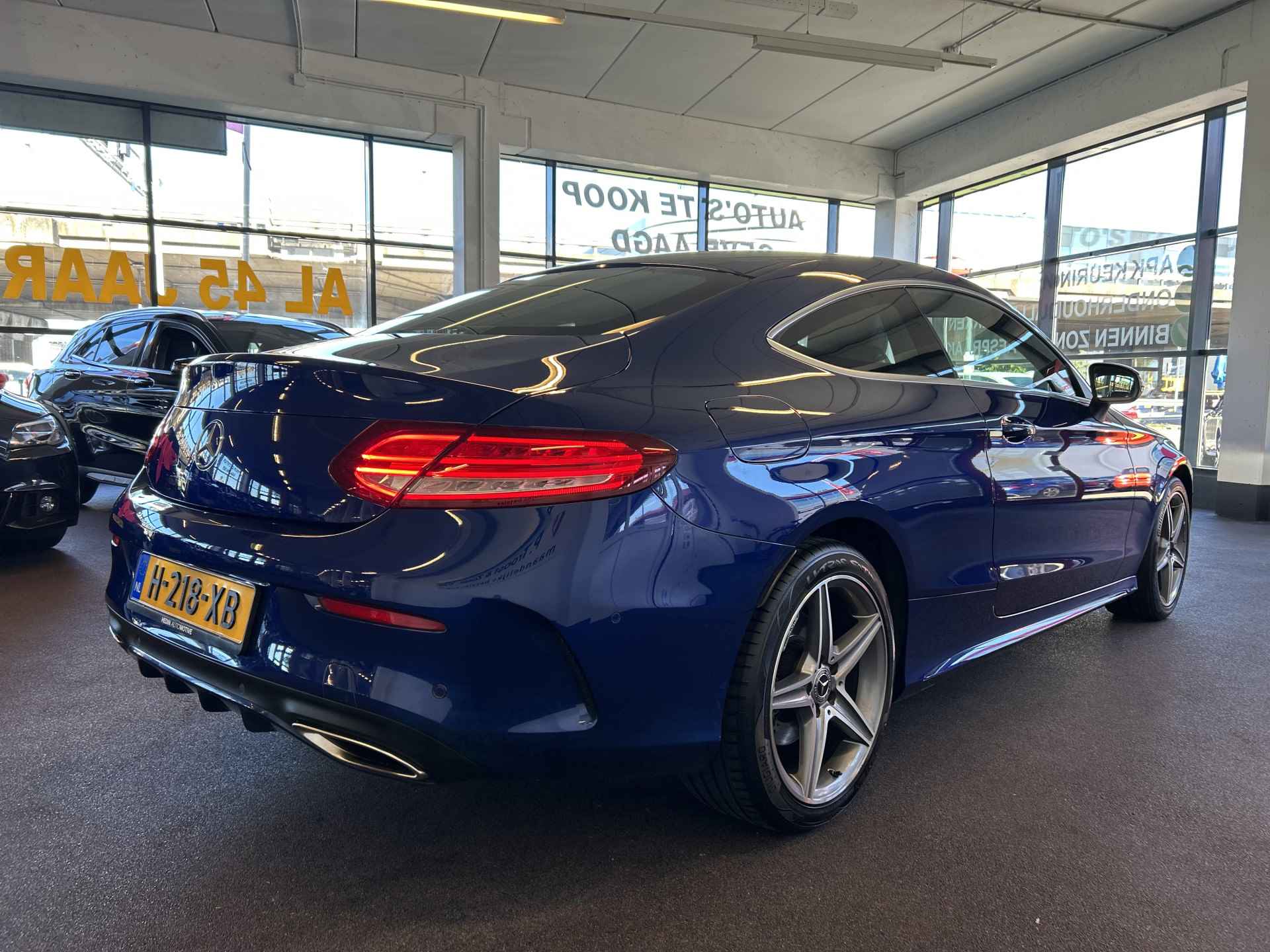 Mercedes-Benz C-Klasse Coupé 180 AMG Exclusive | Automaat | Lederen bekleding | Dealer onderhouden | Adaptief onderstel | Achteruitrijcamera | Cruise c - 30/33