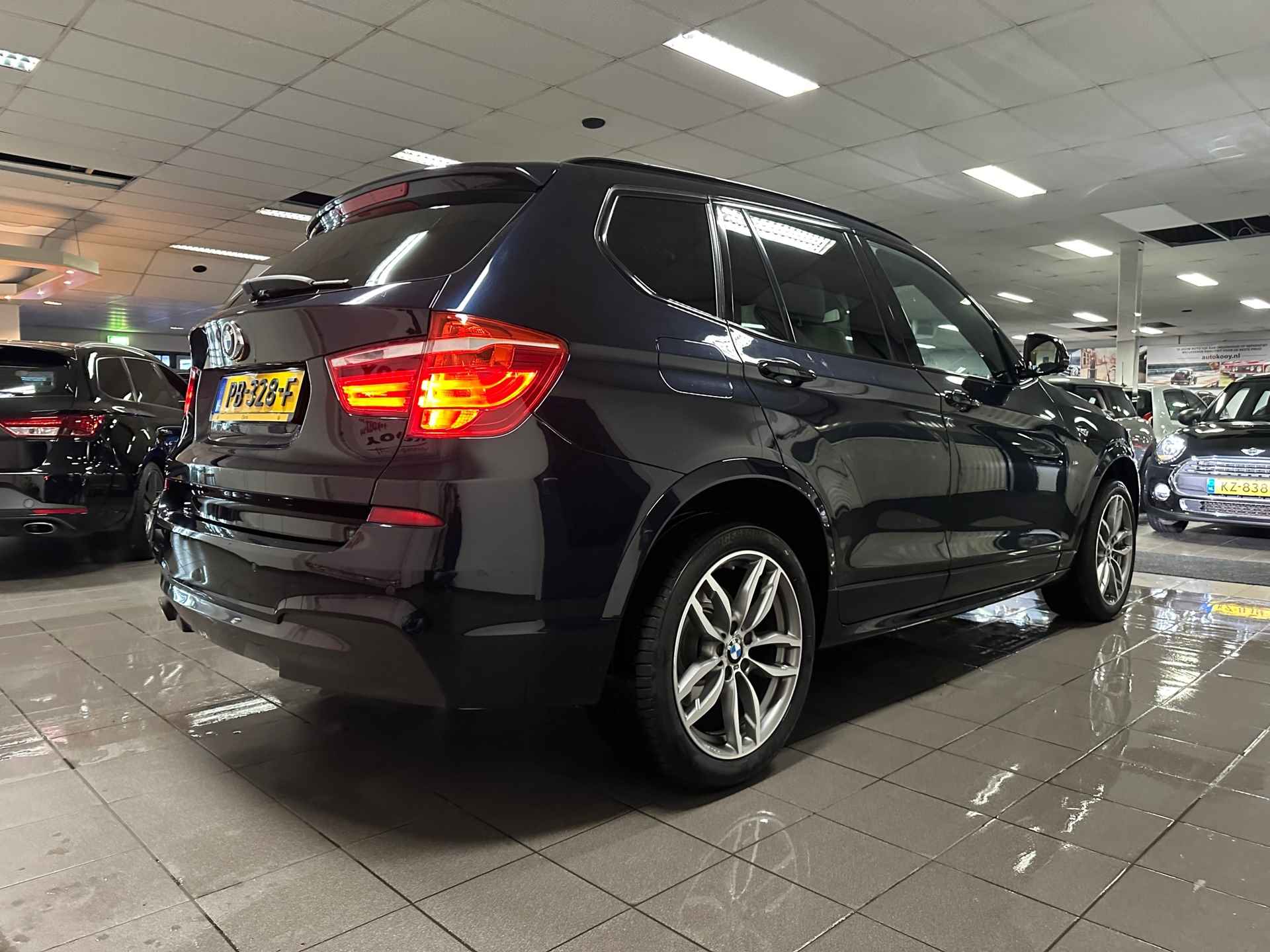 BMW X3 SDrive20i High Executive M-Sport * NL Auto / Elektr. Trekhaak / Xenon / Navigatie * - 7/24