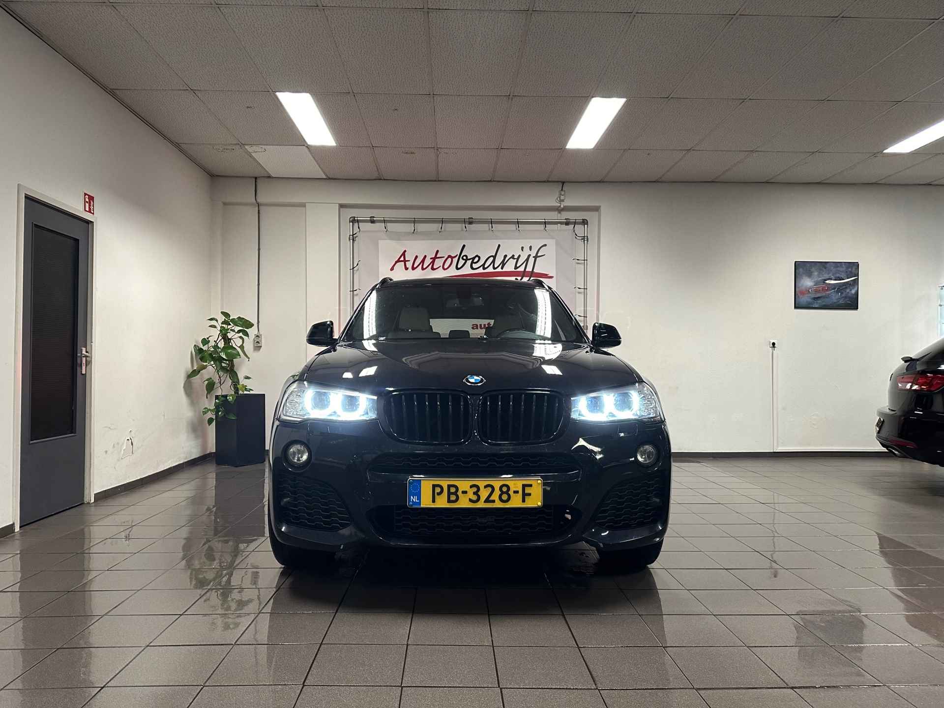 BMW X3 SDrive20i High Executive M-Sport * NL Auto / Elektr. Trekhaak / Xenon / Navigatie * - 9/24